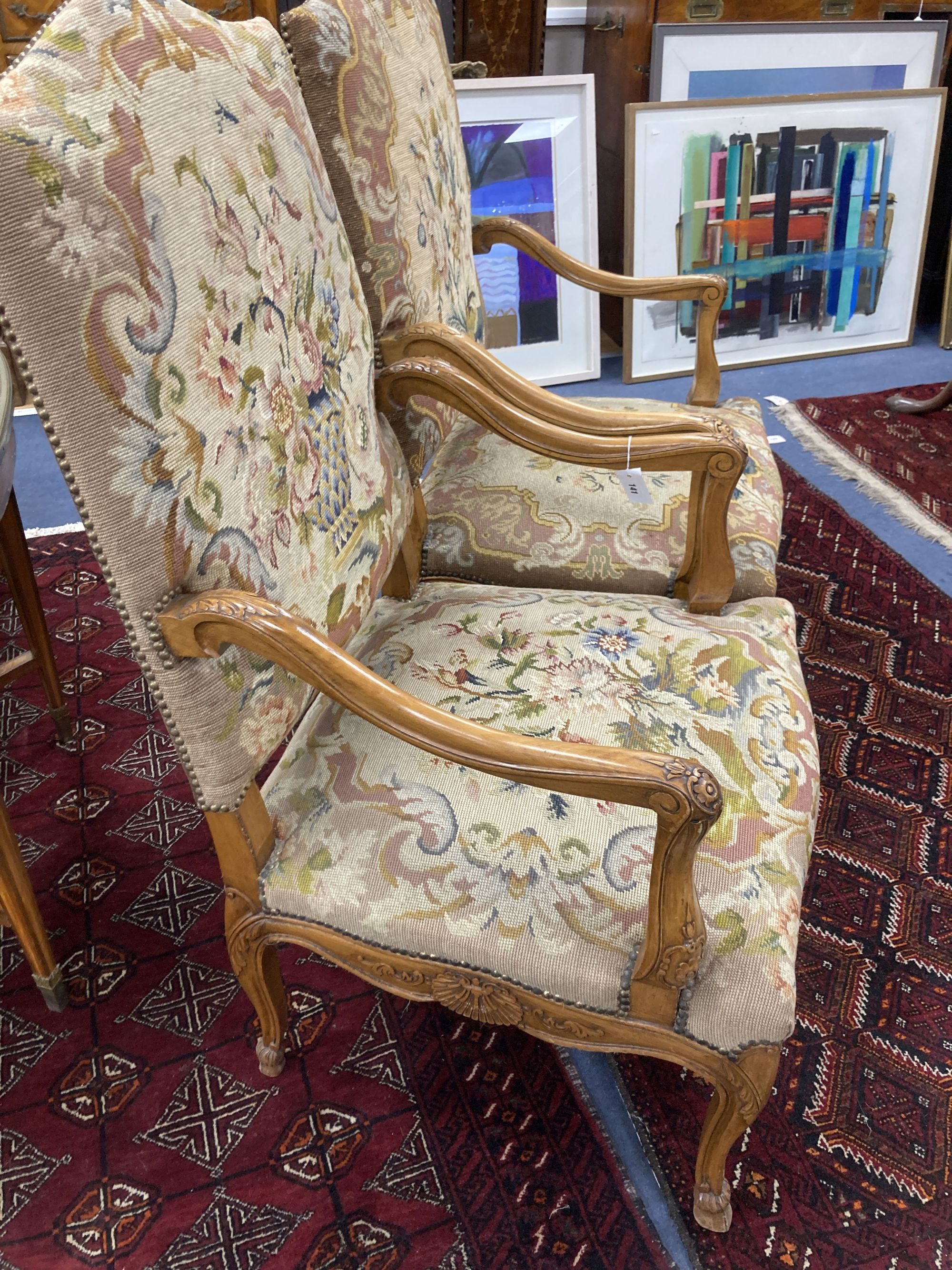 A pair of Louis XV style needlepoint armchairs, width 69cm, depth 60cm, height 110cm